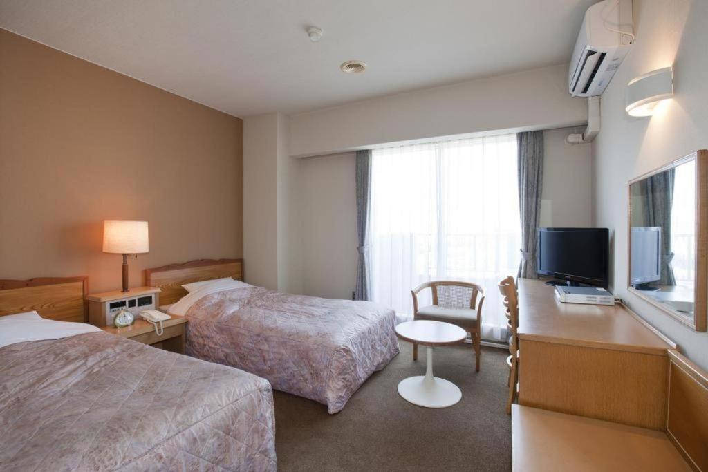 Hotel Tenchikaku Хитати Экстерьер фото